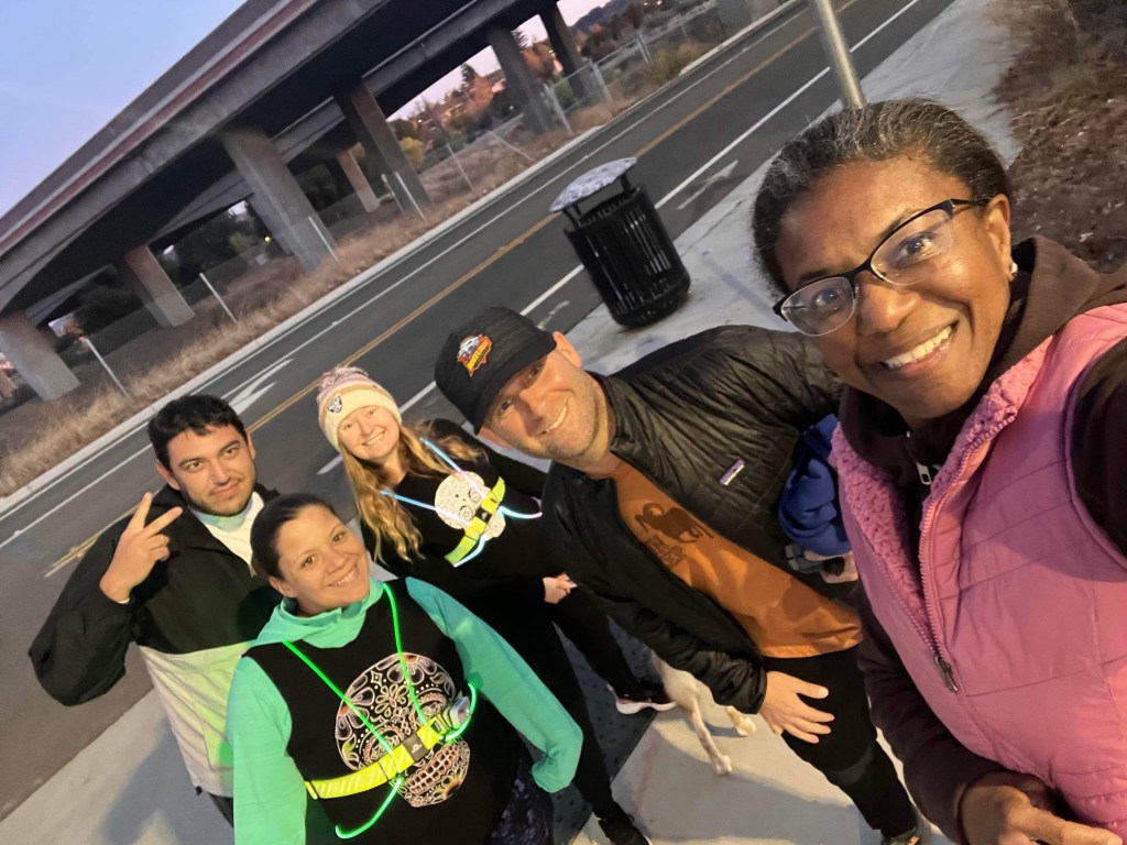 Happy friends celebrate a friends major trail race 2022