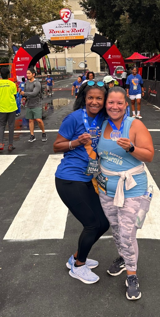 Two bright smiles after RnR 5k, 2023